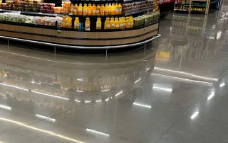 Shiny grocery store concrete with reflection of produce after Diamond Devil was used